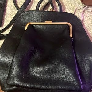 Black, medium size woman’s backpack purse